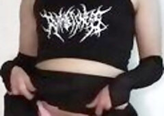 A cute femboy casually fondles his penis