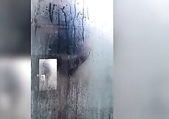 In a fog filled washroom this cute and nasty brat of a transgirl wears a taut little ebony suit whilst drenching herself underneath steaming hawt show