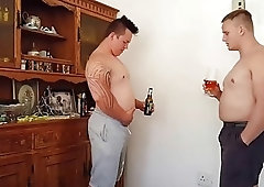 Two chubby guys feed each other and worship their bellies