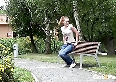This hawt redhead doesn't care who sees her take a urinate! Sitting on a bench in a public park this babe just pulls down her jeans and lifts her