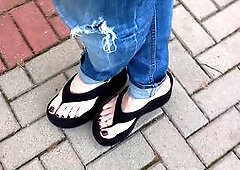 Crossdresser seduces with his high heels outdoors