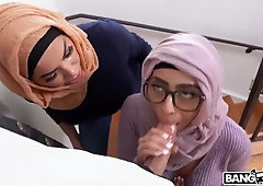 Gals with head scarfs are taking turns fellating a rock-hard fuckpole and railing it like cocksluts
