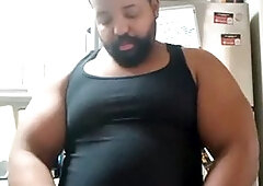 Thick bear strokes his cock and cums all over himself