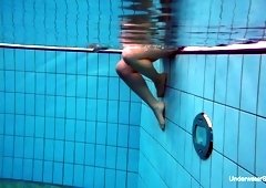 Seductive red haired swimmer Katrin Bulbul gets naked under the water