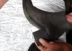Cumming on her ankle boots