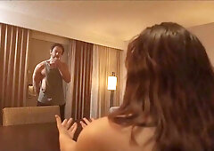 An artist gets painted by a suspended model