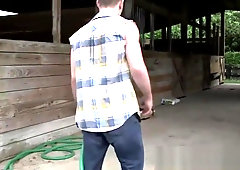 Fine muscular farmer assdrilled outdoors