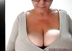 U50 cougar is trying to tease males by rubbing her massive melons on livecam,