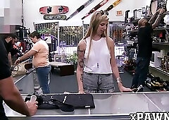 Inked chick bounces on a big dick for some money in pawnshop