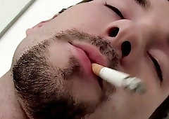 Twink relaxes while smoking solo and stroking his hard cock