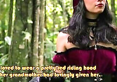 Little Red Riding Hood walking alone in the forest