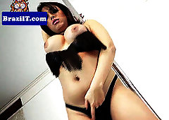 busty latina ladyboy tugging her hard-on