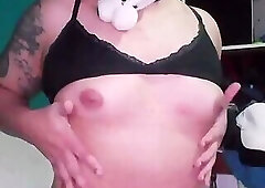 Feminine femboy with big breasts.