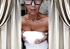 This extremely impressive and pleased old woman puts on a real show for her fans in the kitchen. This babe gracefully moves to the beat of the music, 