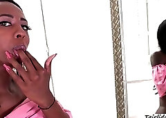 Beautiful Ebony Shemale babe Tayla stroking her black shedick solo