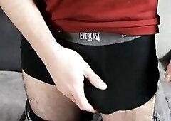 The handsome guy masturbates his penis with the foreskin.