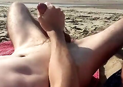 two DUDES MILKING AT THE BEACH
