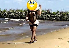 Mature Russian woman pleasures herself on a secluded sandy beach