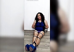 Trans woman in trouble, totally tied and gagged in shiny hose, high heels, and a blue mini-costume. That babe orgasms from the friction...
