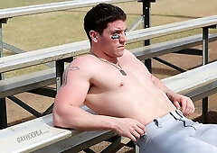 Sporty hunk Jeff Niels massaging his huge penis