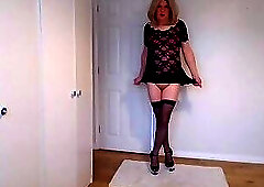 Black hold up stockings, lace minidress, pink bra and no panties