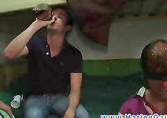 Blindfolded dude sucking dicks