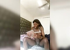 Black t-girl playing with her large jock