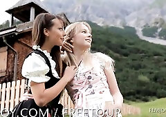 Small brunette hair Lorena and merry golden-haired Belinda frolic and romp outdoors, stripping off their dresses and enjoying the new mountain air.