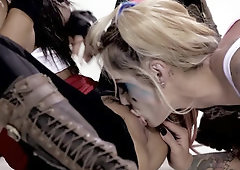 Wearing masks and makeup, these two are into some lesbian fun