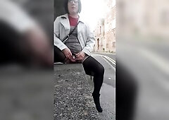Hot crossdressing floozy exposes her sissy caged jock and fingers her butt on a public street