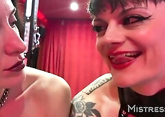 Mistresse Ae and Miss Flora get dangerously close in this seductive POV scene, making out, teasing, smiling, and showing off their sharp fangs in adva
