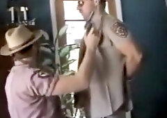 cowboy sheriff gives cop a blowjob