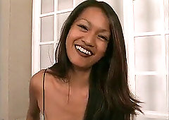 steamy asian de-robe teases and poses nude