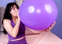 See me blowing a massive balloon with my wet lips until it's about to burst, my sexy breath making it grow larger a nd larger whilst my breasts r
