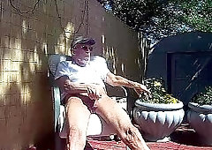 Mature abusing himself in the garden