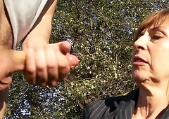 Mature redhead gives head in public and likes being taped