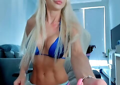 Muscular blonde woman's intimate webcam session in private room
