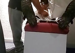 Tickling a bound man's bare feet