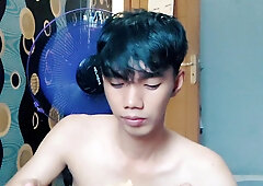 Gorgeous young dude is slurping noodles sans using t tee-shirt