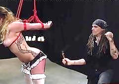 Spanking a bound blond chick and making her moan loudly