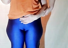 This Babe wears blue shiny spandex,  showing off her unfathomable cameltoe and large butt. Older PAWG in yoga panties.