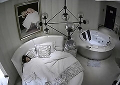 Spy cam in motel room captures Asian couple having sex