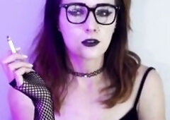 Darksome gothic hotty smokes during the time that wearing fishnet nylons. This babe takes slow, seductive drags with her ebony lipstick and fishnets o