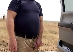 Taking a leak in the country.