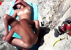 Beach Voyeur. Super horny teen getting off right on the nude beach