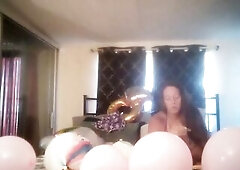 Incredibly excited gal takes off her costume and smokes cigarettes and pops balloons in nature's garb