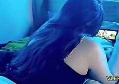 Young Latina teen caught watching steamy content on her phone in blue-lit bedroom