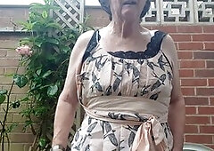 Mature babe Betty Spanxxx shows off her lingerie and girdle in the great outdoors