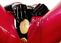 Bondage porn woman in vacuum latex toyed by BDSM master