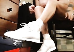 I slide on my ruffled socks, then my low top white Reebok sneakers. I carry on doing my normal activates, whilst u get a lengthy clear view of my snea